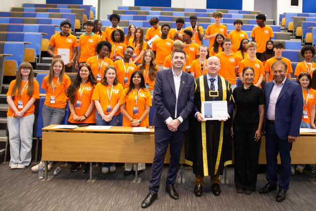 The graduating cohort with Professor Sloan and Shaun Davies MP