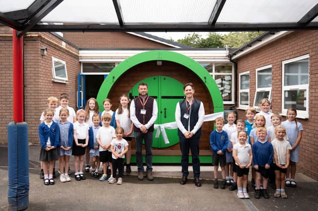 L-R Bradford Estates construction director Graham Young and executive chairman Alexander Newport with school pupils from St Mary's CE First Academy