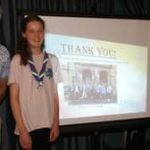Rotarian Johnathan Callwood with Lucy next to her screen talk