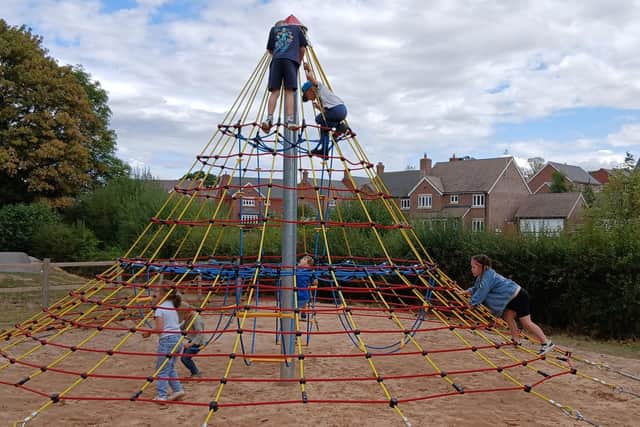 Climbing the 4m rope tower and reaching the top!
