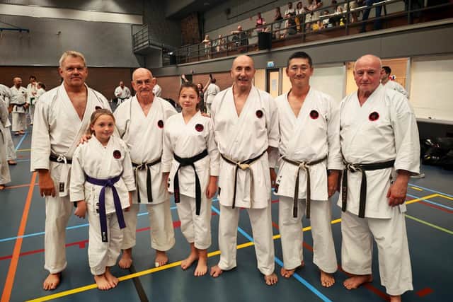 Norah and Honor with sensei Henrik Larsen (Denmark) sensei Ernie Molyneux (England) sensei Jorge Montiero (Portugal) sensei Tetsuji Nakamura IOGKF World chief instructor and sensei Roy Flatt (England) who received his 9th Dan at the event