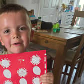 Arlo with his sponsorship poster