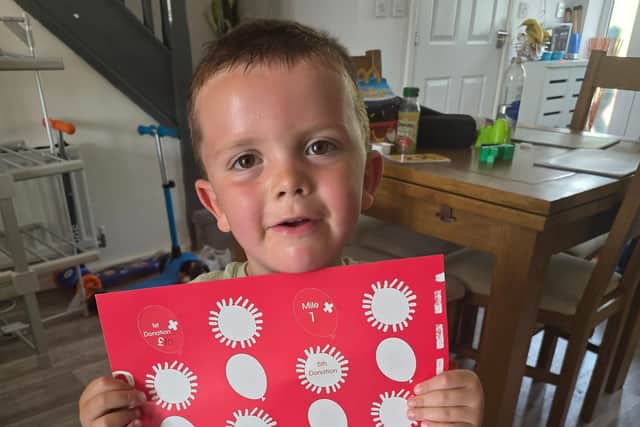 Arlo with his sponsorship poster