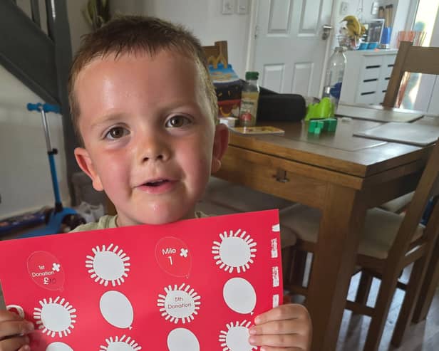 Arlo with his sponsorship poster
