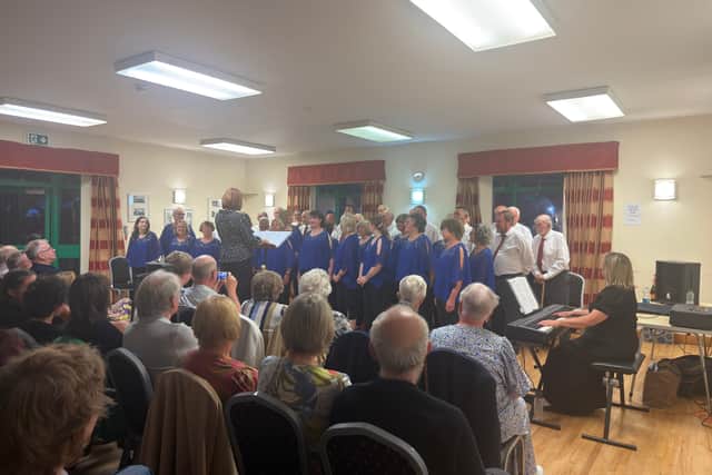 Both choirs performing