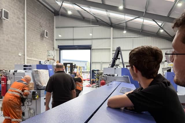 Manufacturing Lead Dan Farrar (right) and Josh Botfield (CNC Setter Apprentice) watch as one of two new CNC sliding-head lathes is manoeuvred into position at GWR Fasteners’ Artillery Business Park premises in Oswestry.