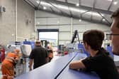 Manufacturing Lead Dan Farrar (right) and Josh Botfield (CNC Setter Apprentice) watch as one of two new CNC sliding-head lathes is manoeuvred into position at GWR Fasteners’ Artillery Business Park premises in Oswestry.