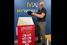 MyWorkwear’s Co-owner James Worthington pictured with the Midlands Air Ambulance charity donation box.