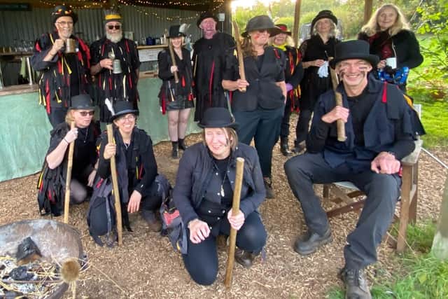 Oswestry Dark Morris relaxing between dances at Apple Pressing