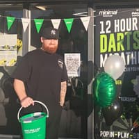 Newport barbershop raises £1,500 for cancer charities after 12-hour darts marathon