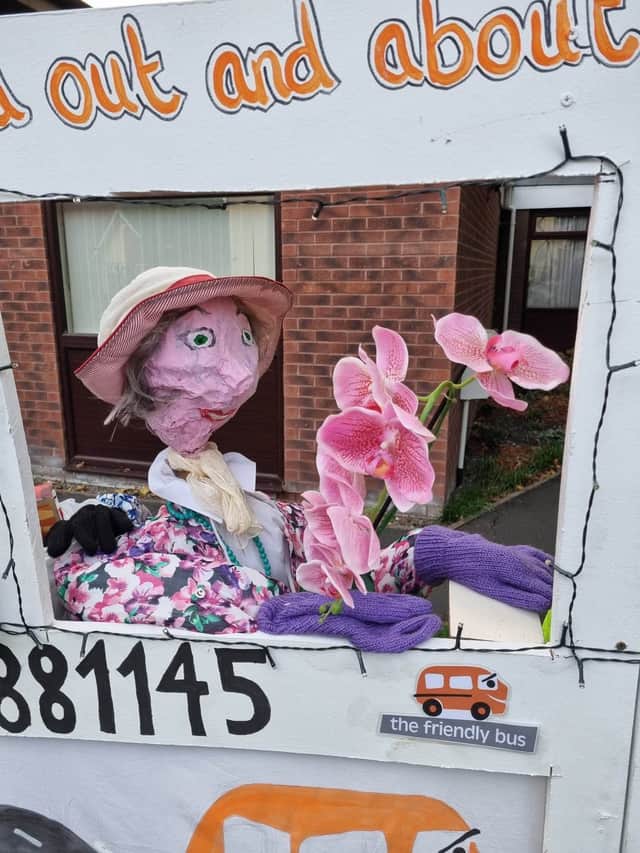 Scarecrow passenger has been to a garden centre and treated herself to some plants!