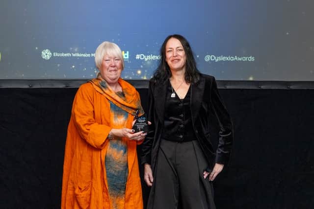 Sally Joyner from In the Loop presents Jane Pickworth with her Amazing Artist Award