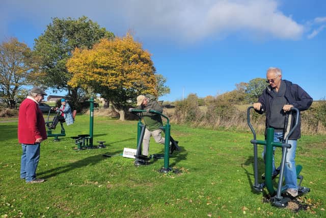 Parish Councillors try out new outdoor gym equipment at Annscroft