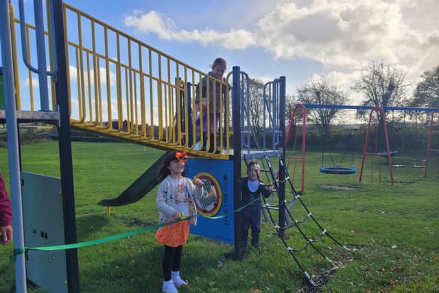 Ribbon cutting for new play equipment at Annscroft play area
