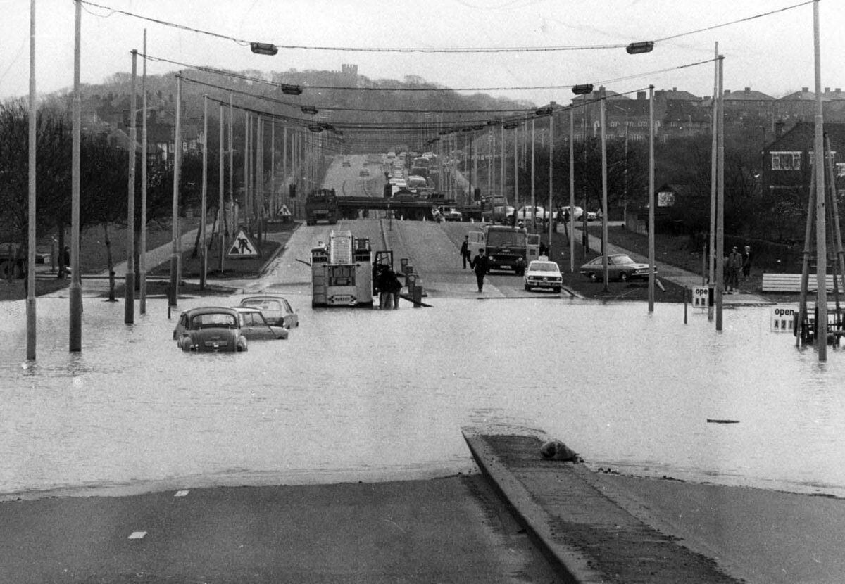It's not always the rain to blame. These cars were left stranded on the Birmingham New Road in Coseley in March, 1972, after a 12 inch water main burst.