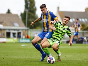 Tom Flanagan of Shrewsbury Town and Josh March of Forest Green Rovers.
