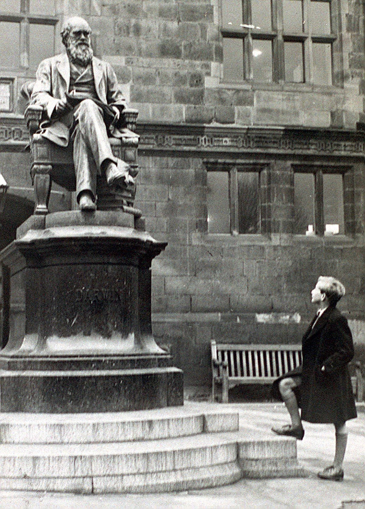 The Charles Darwin statue in Shrewsbury, pictured on February 1, 1949, being admired by John Howard Davies, who played the title role in a 1948 Oliver Twist movie.