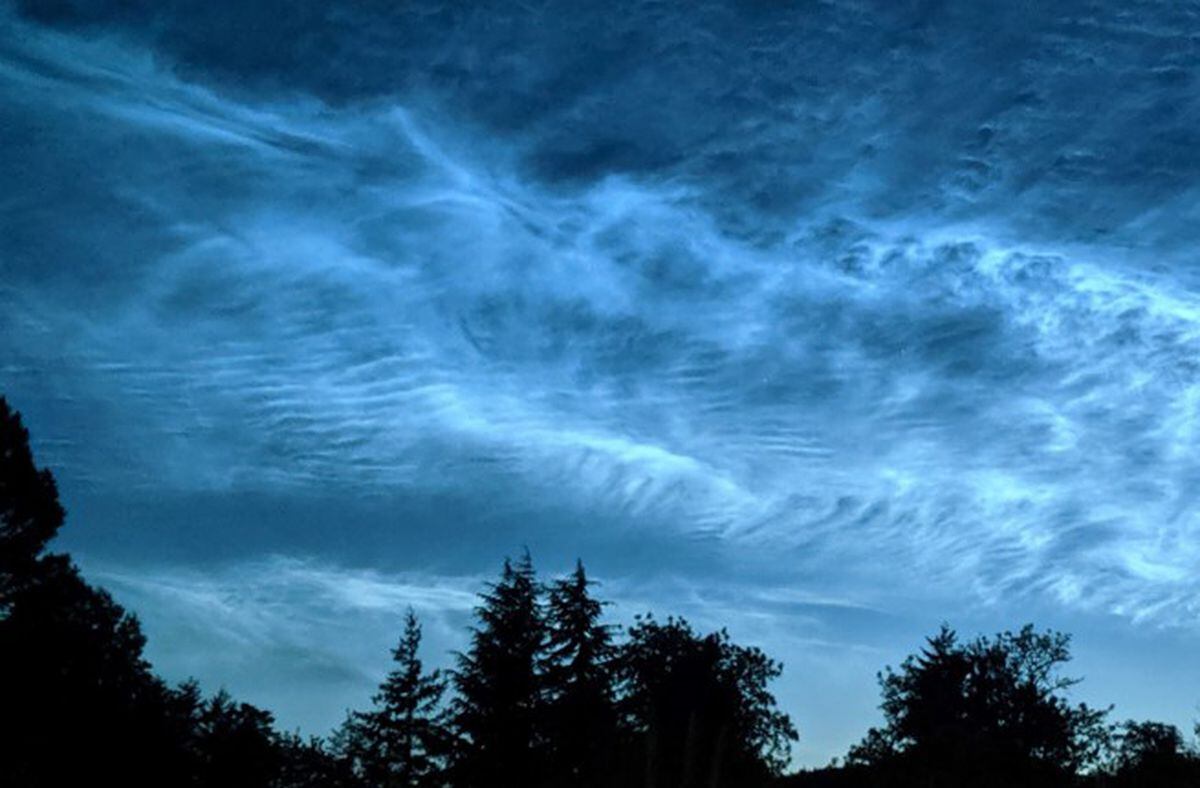 Noctilucent clouds, a spectacular phenomenon of the summer twilight sky.