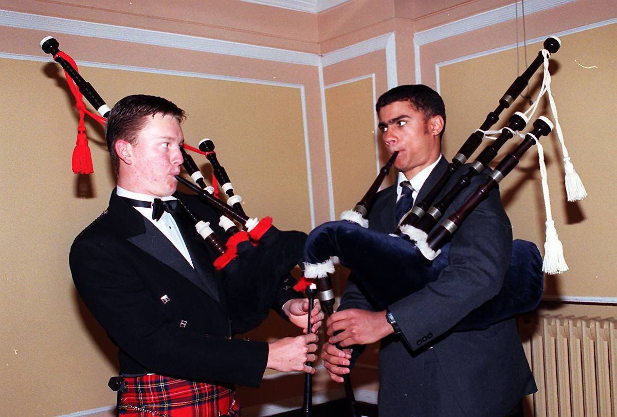 Tuning up for Burns Night in 1998 are Shrewsbury School students Breck Lord (left) from Texas, Queensland, in Australia, who was of Moser's Hall at the school, and Archie Farmer from Fiji, of Churchill's Hall. 
