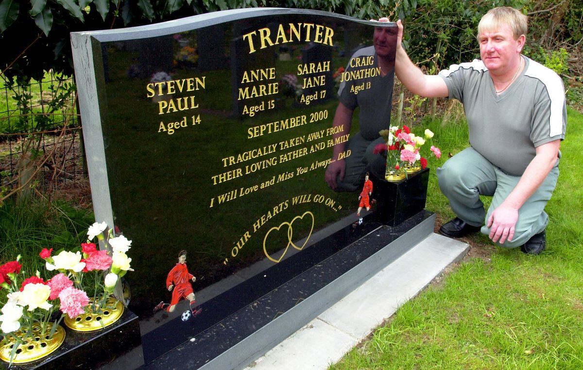 Michael Tranter with the headstone to his children