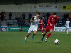 Montel Gibson (18) (AFC Telford United Striker on Loan from Ilkeston Town) bringing the ball down the wing bing pressured by Spennymoor player.