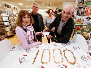 Paul Jones, left, presented the £1,000 from the people of Grinshill to the Red Cross in Oswestry: Lynn Moses, lead volunteer, Ian Driscoll and Karen Reynolds, manager