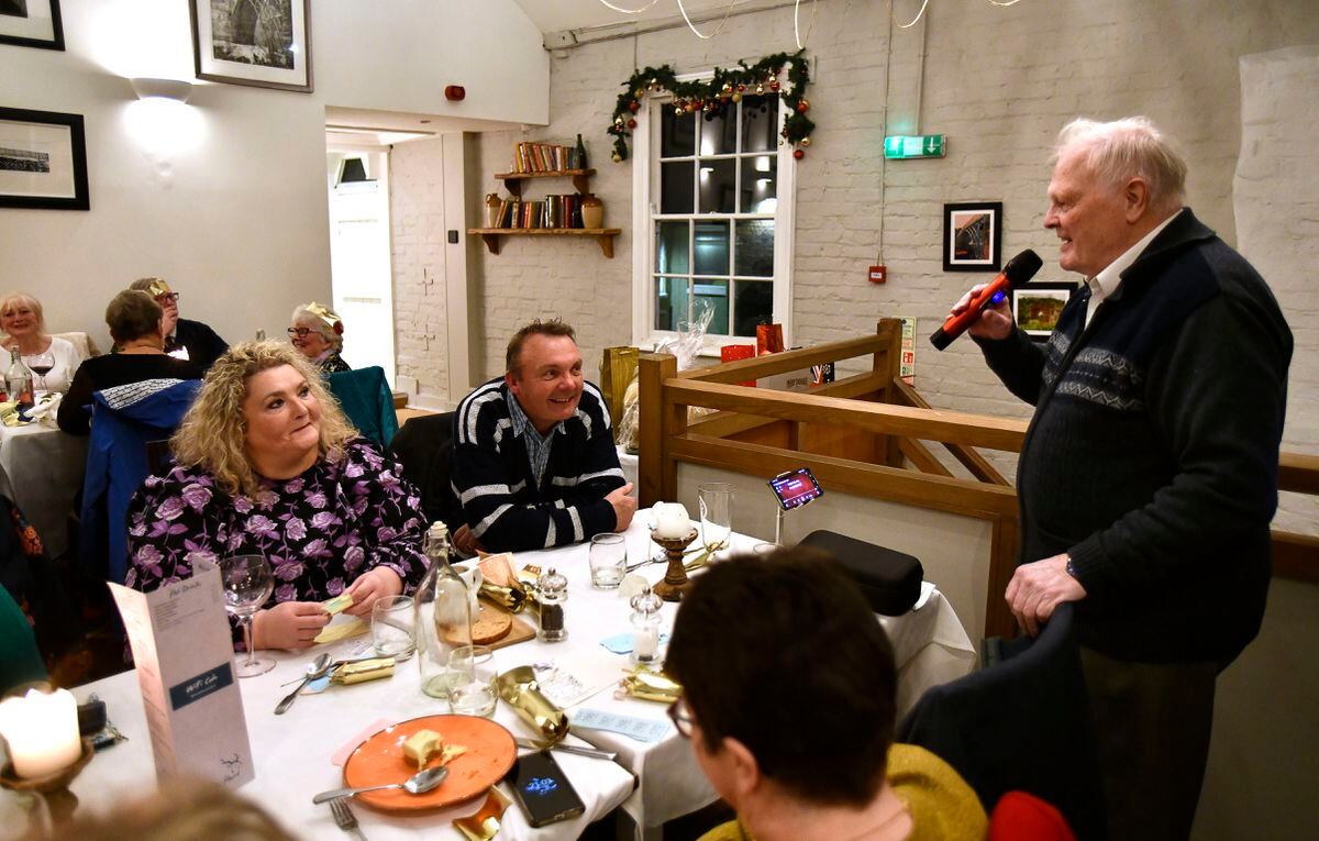 The Ironbridge & Coalbrookdale Civic Society Christmas dinner at the White Hart in Ironbridge. Singer Colin Dale entertaining diners. Picture by Dave Bagnall