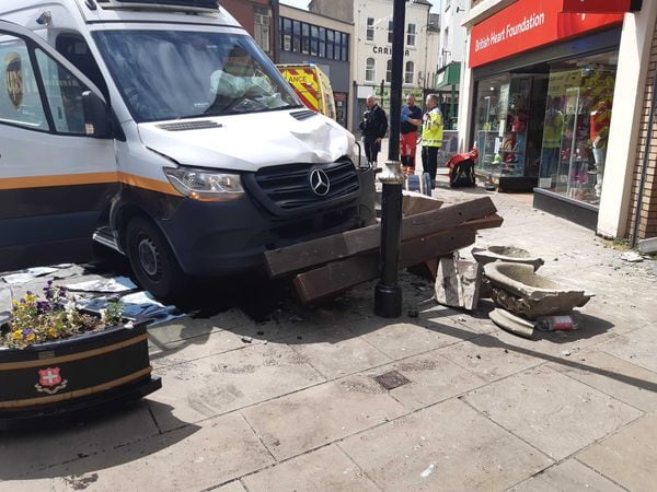 The van crashed into benches 