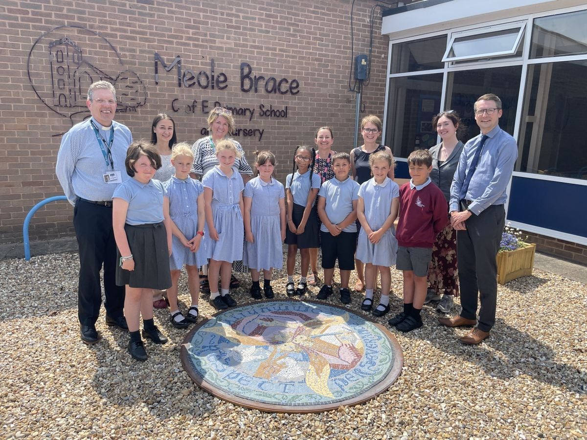 Staff and pupils from Meole Brace CofE Primary School and Nursery and Shrewsbury School with the mosaic