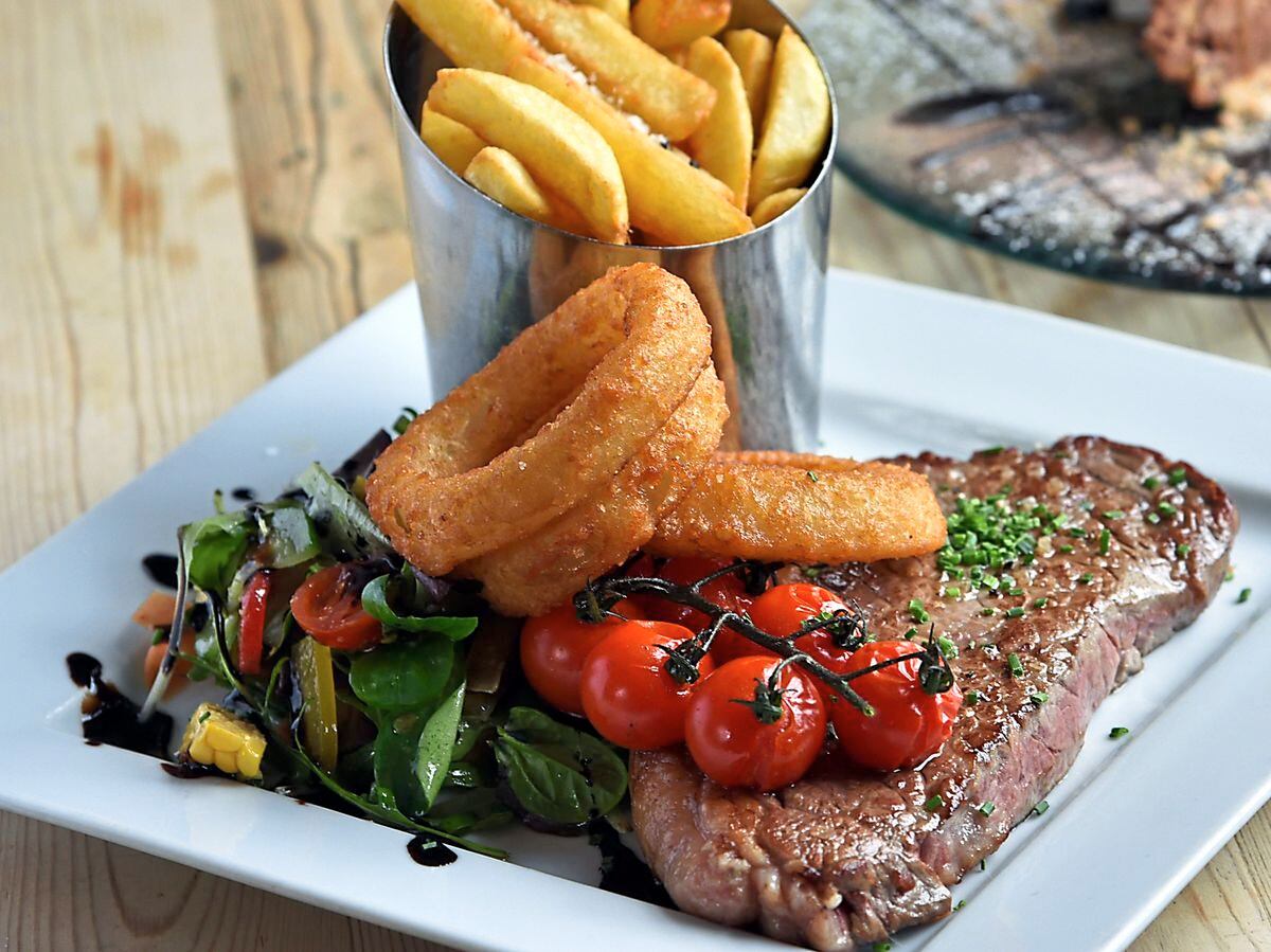 Classic meal – steak and chips with onion rings and juicy tomatoesPictures by Russell Davies