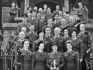 Mrs Margery Middlecote, front, holding the trophy, with chief and leading observers based at Shrewsbury and surrounding area. The date and occasion are unknown.