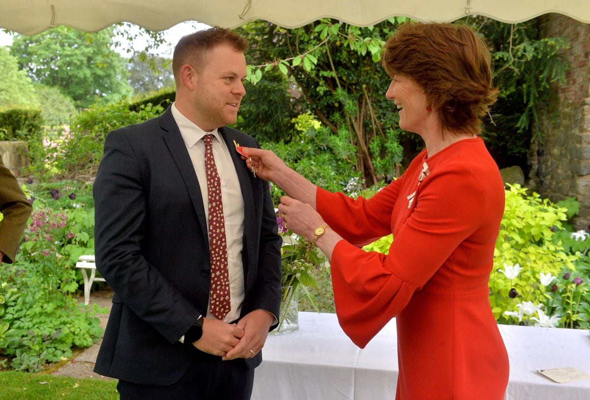 Shropshire's Lord Lieutenant Anna Turner presents the MBE to Gareth Smith.