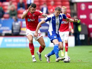 Charlton Athletic's Ryan Inniss (left) and Wigan Athletic's Charlie Wyke