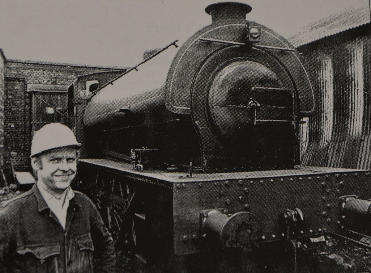 Trevor Matthews in his pit gear with Cannock Chase coalfield's last steam locomotive No7, at Littleton in 1974