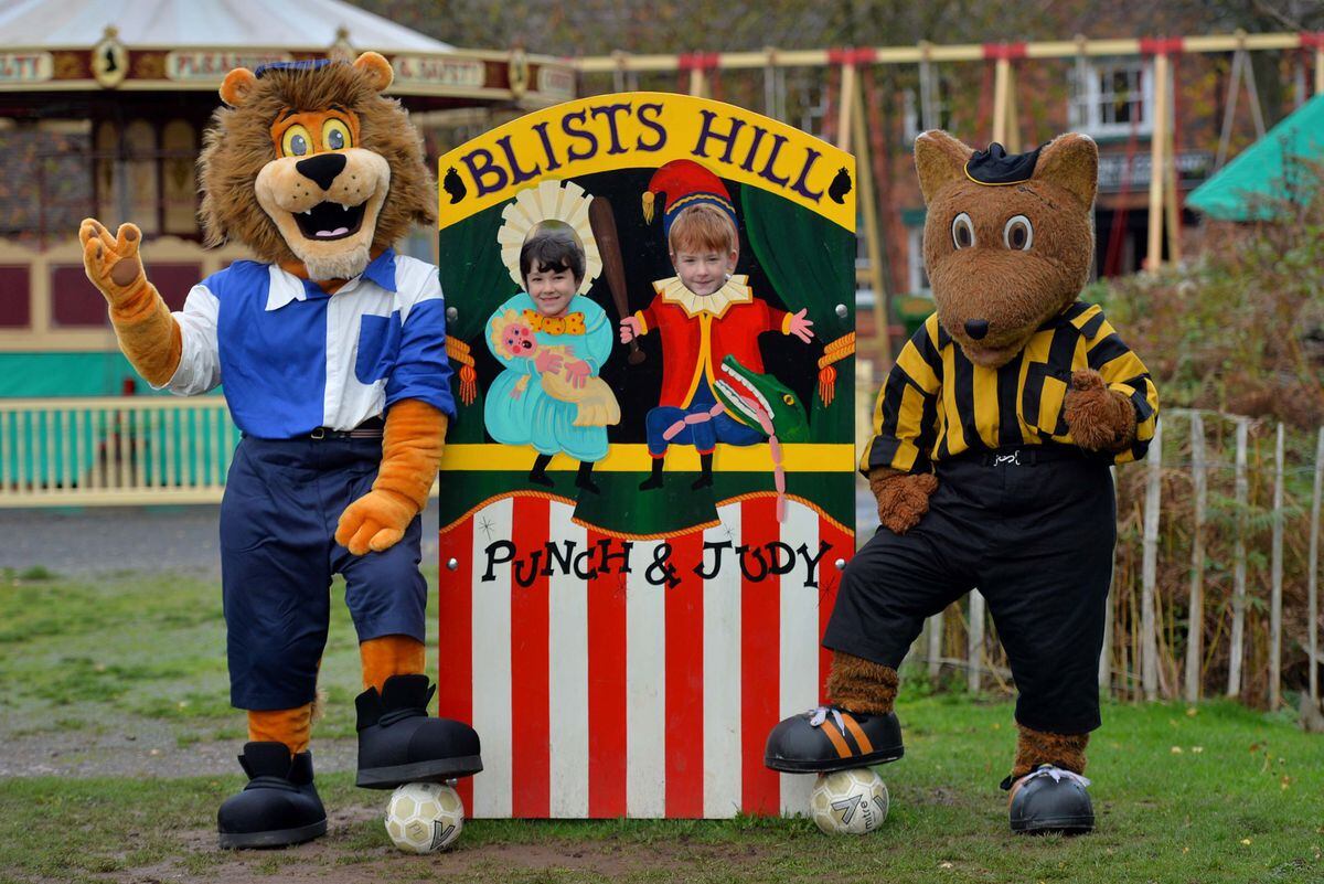 Wolves mascot Wolfie and Shrewsbury’s Lion show off the historic kits with Christ Church CE School pupils Frankie Finley, six, and Arna Wilkin, seven