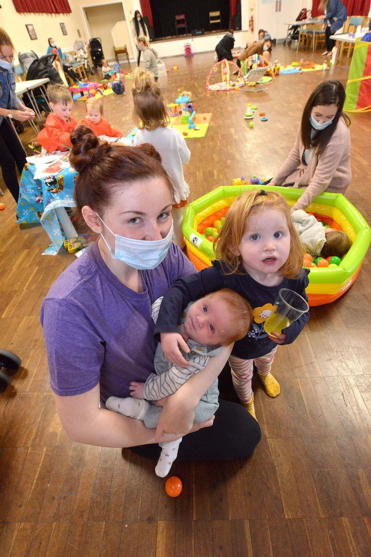 Emily Reeves, 22, with three-month-old son Charlie and daughter Rosie, two