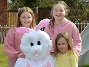 Beau Parton, eight; Olivia Meek, eight; and Darcy Jones, three, with the Easter Bunny