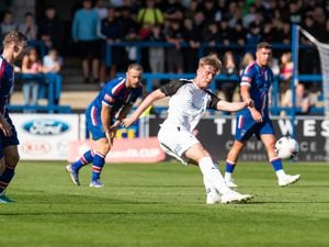 George Burroughs (30) (AFC Telford United Defender on load from Coventry City) passing the ball through midfield (Pic: Kieren Griffin Photography).