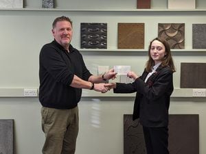 Jesmonite managing director, Piran Littleton presents a cheque of £500 to Lilith Pearson of The Community College in Bishop's Castle.