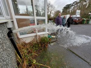 Rob Stevens, Tom Fountain and Pete Hilditch watch as water pumps spray away from Coton Manor
