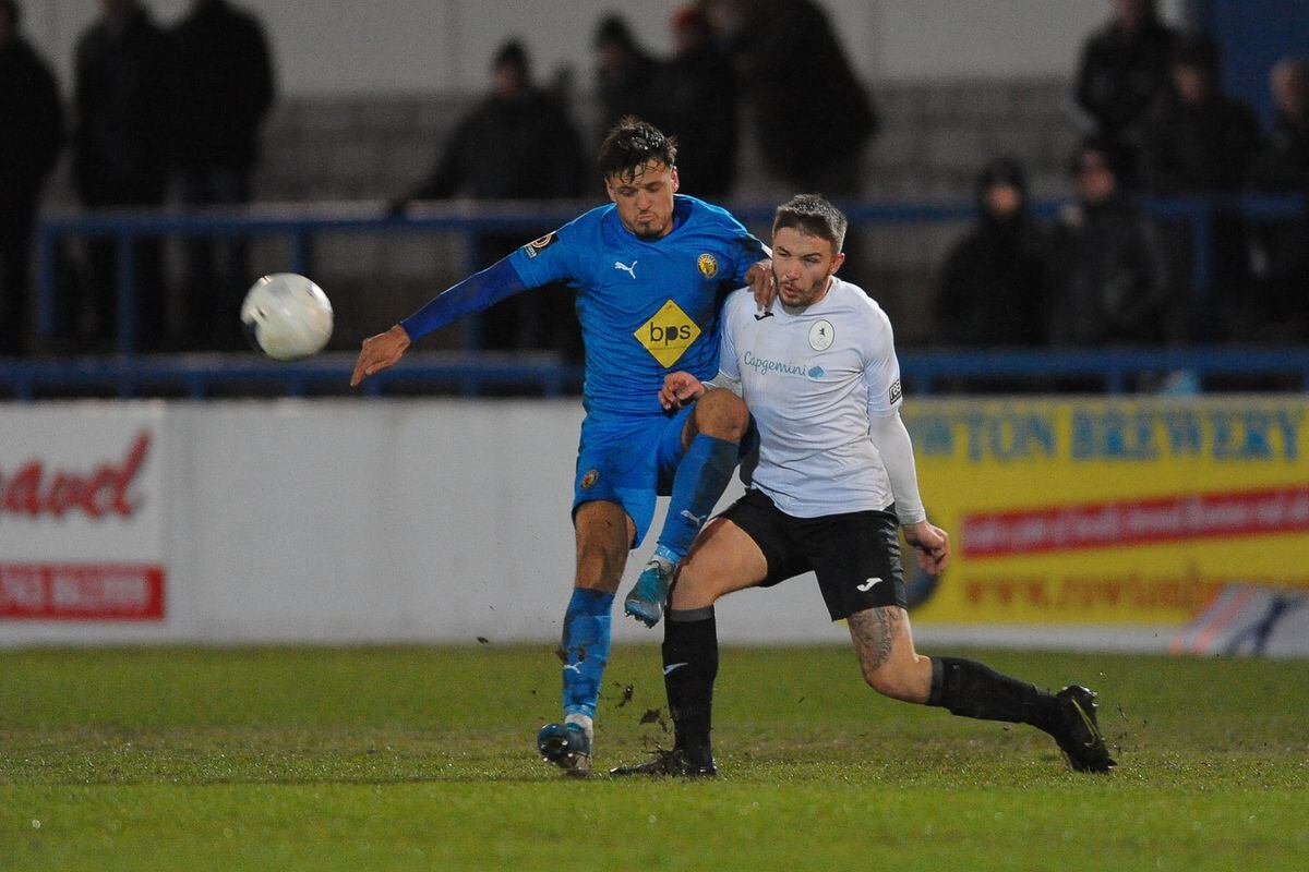 Zak Lilly battles for the ball during the FA Trophy Round 1 fixture between AFC Telford United and Leamington at the New Bucks head Stadium