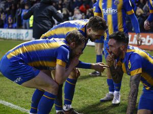 Ryan Bowman of Shrewsbury Town celebrates with his team mates after scoring a goal to make it 2-1..