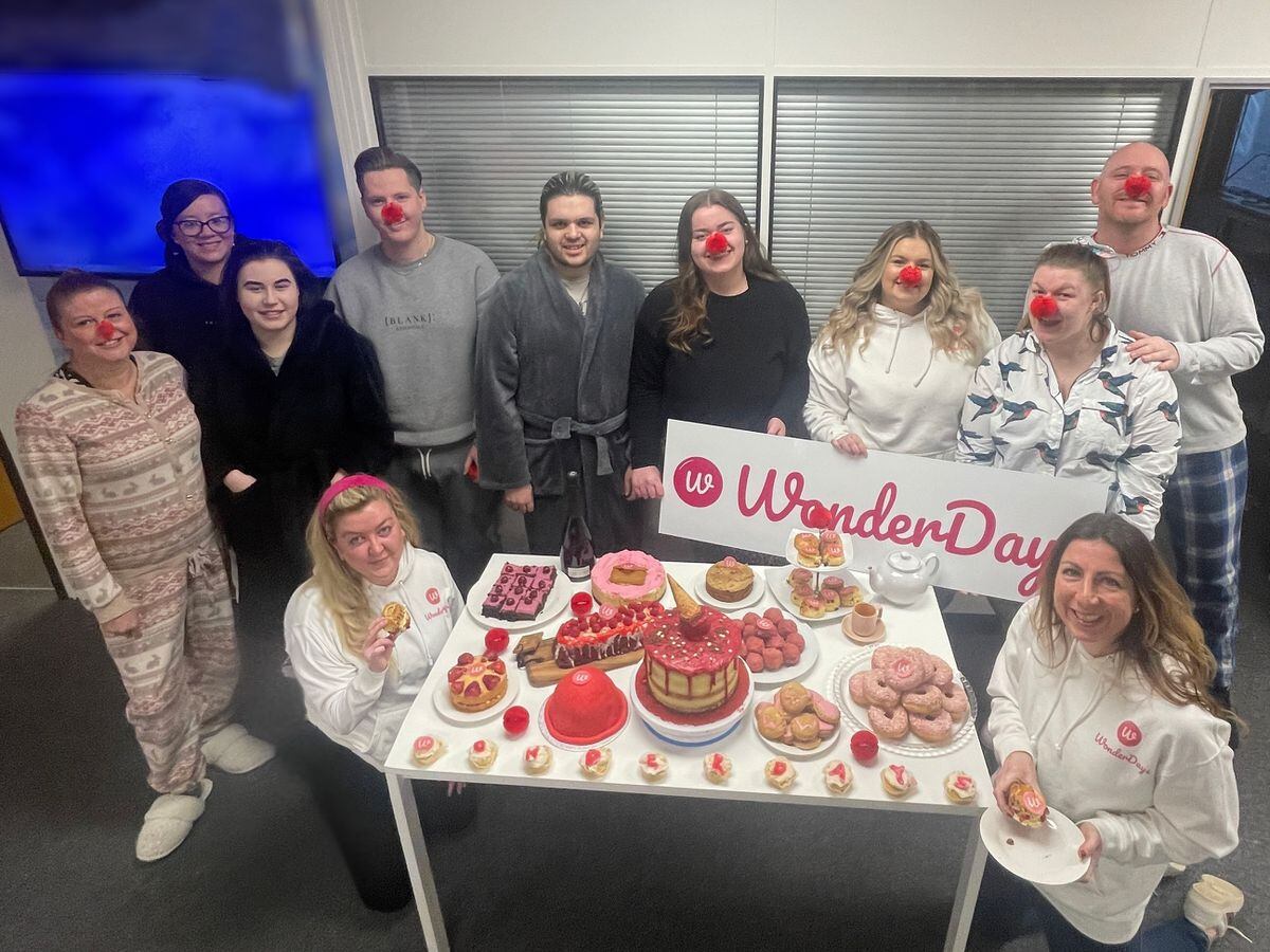 The WonderDays team with their host of home baked afternoon tea creations to raise money for Comic Relief 2023.