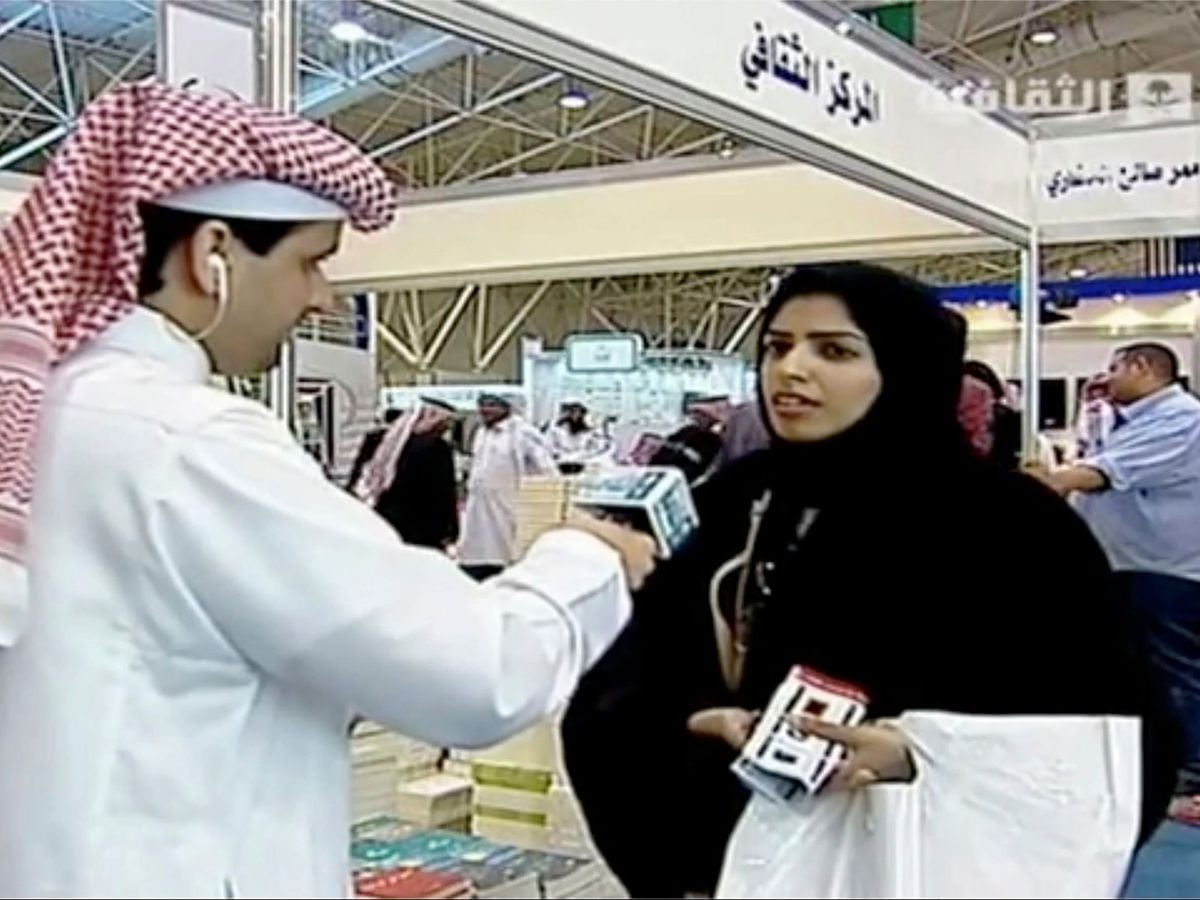 Screenshot of Saudi state TV doctoral student Salma al-Shehab talking to reporters at the Riyadh International Book Fair in 2014