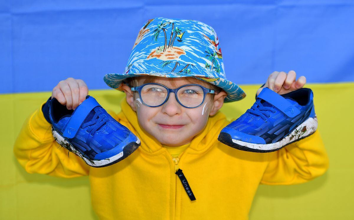 Flynnian McWilliams, aged 7, gets his trainers at the ready for the fundraising walk 