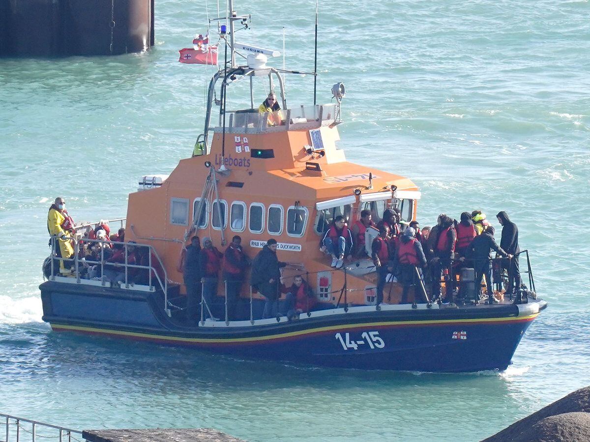 An RNLI boat carrying migrants