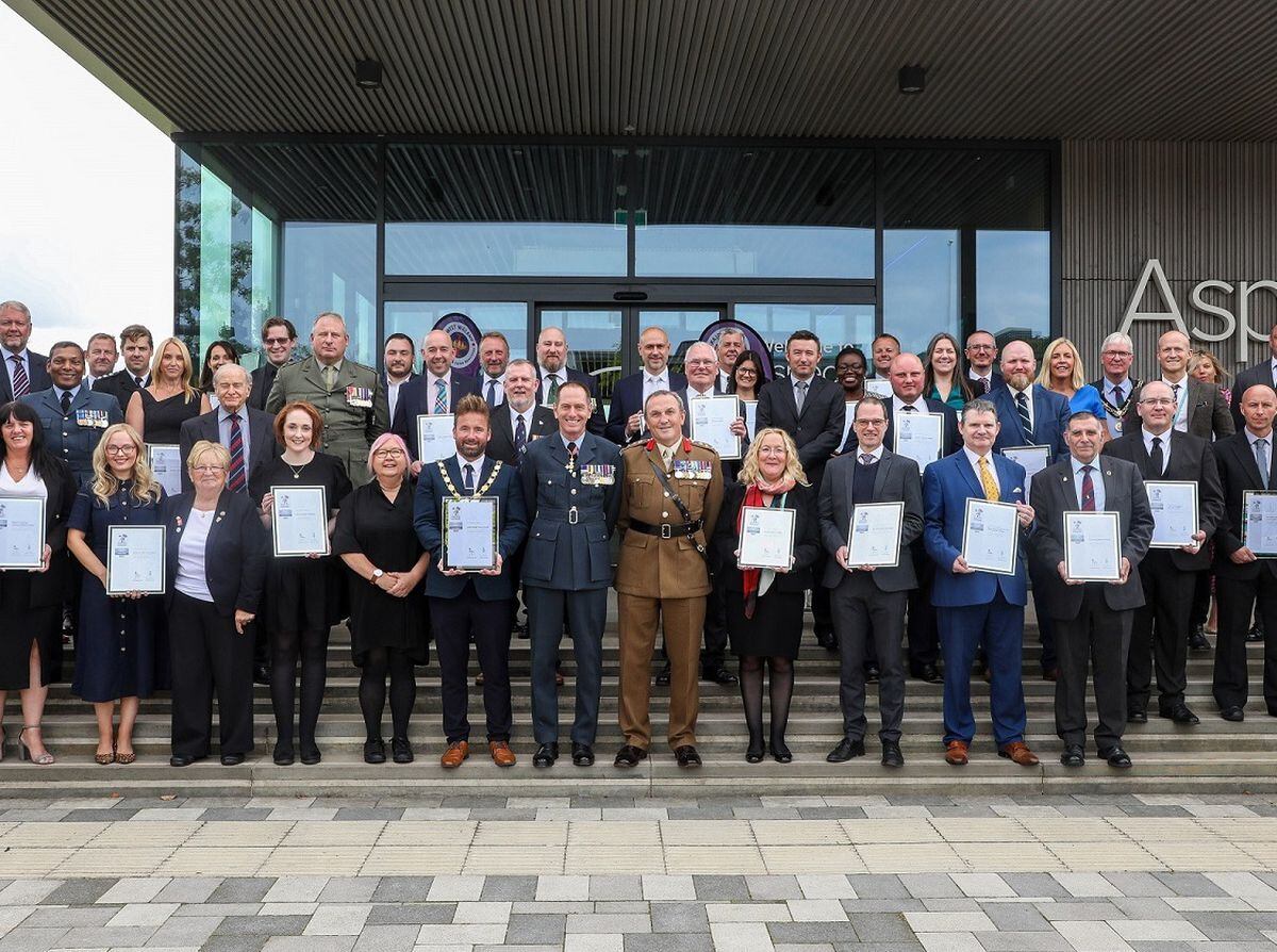 The award winners pose with their awards at the National Memorial Arboretum
