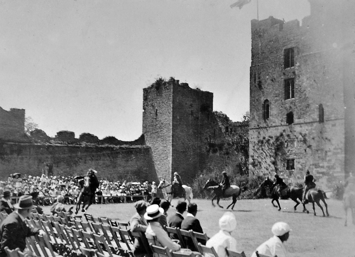 Blessed by glorious weather, an audience watches some of the spectacular action in Ludlow Castle grounds. Picture courtesy of Sir Michael Leighton