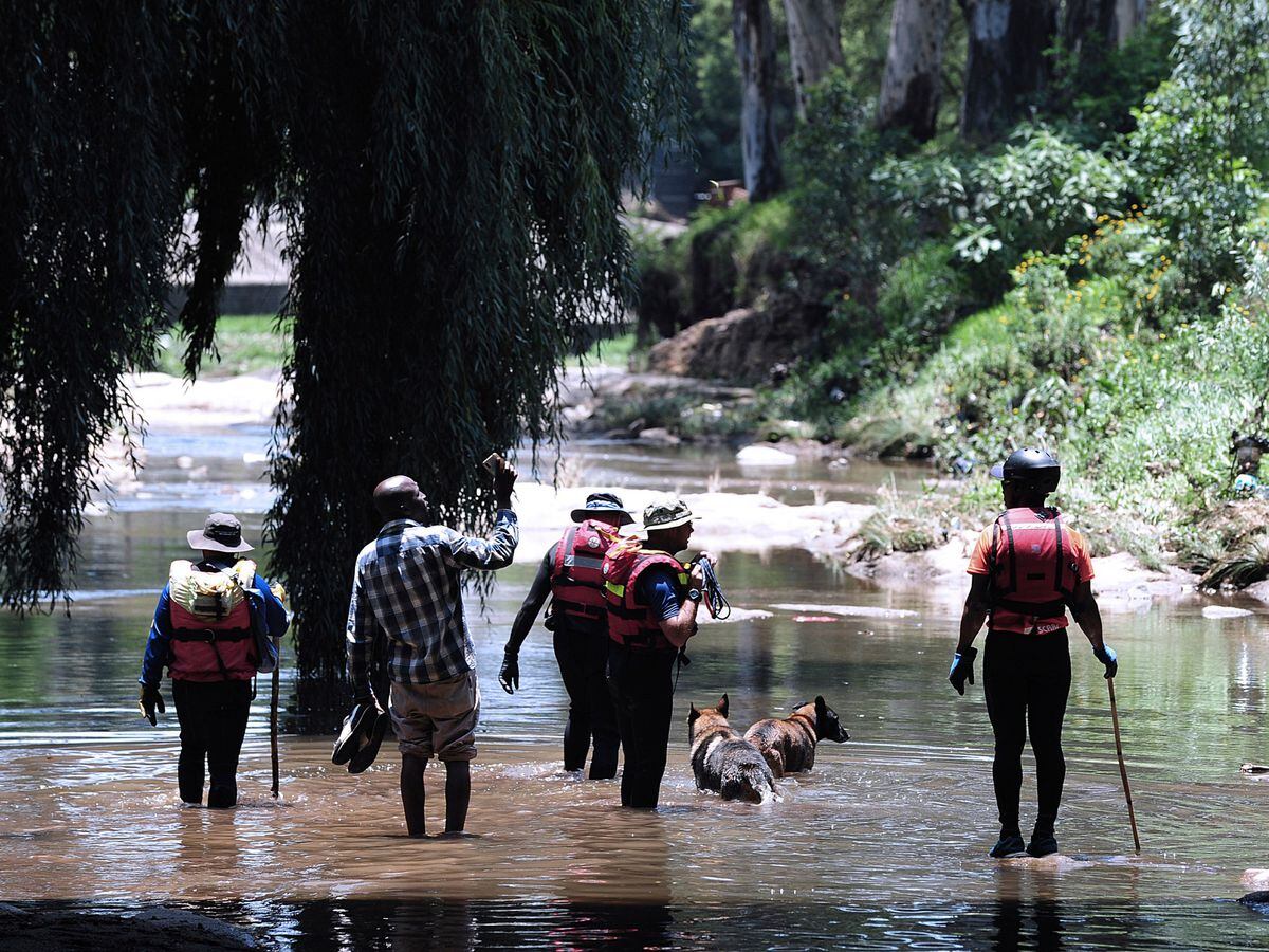 Rescue workers search the Jukskei River in Johannesburg
