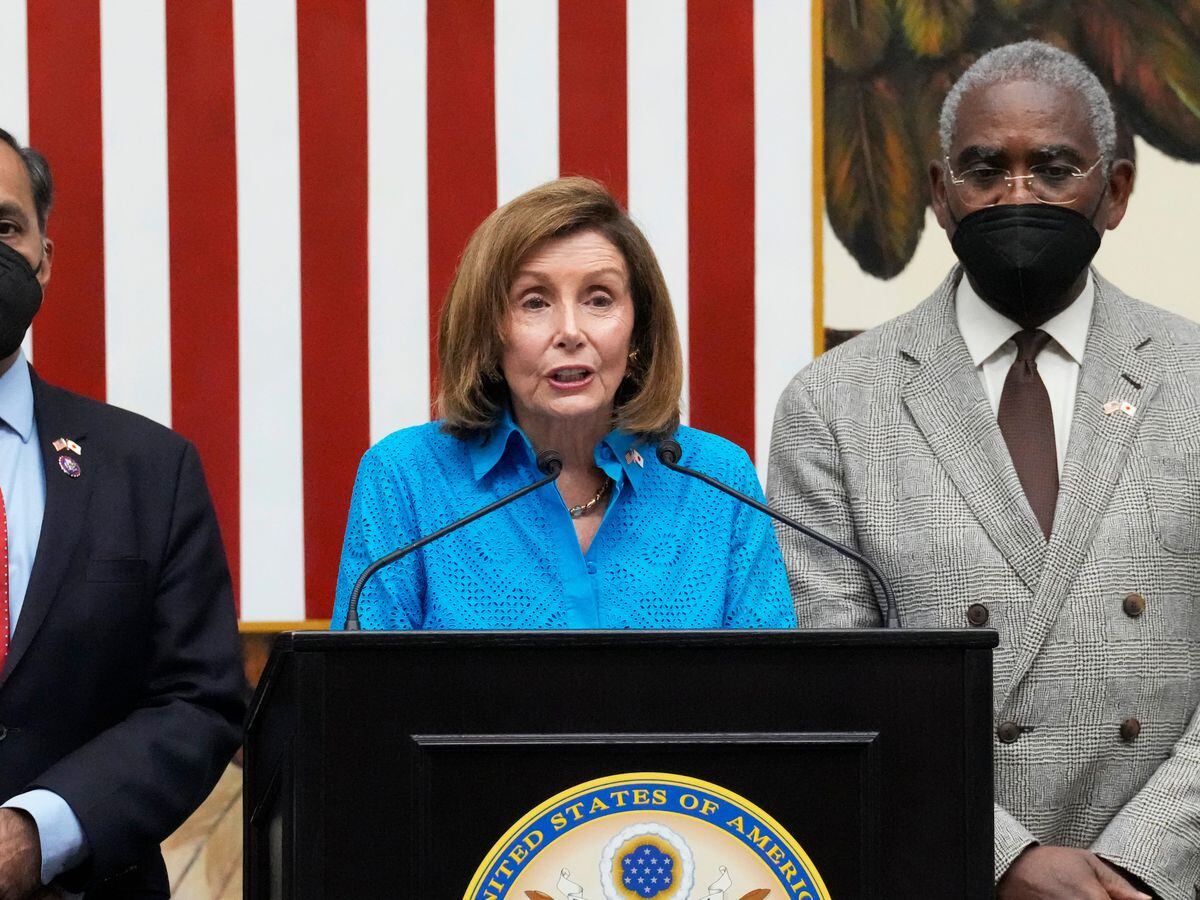 US House Speaker Nancy Pelosi, centre, with a congressional delegation Raja Krishnamoorthi, left, and House Foreign Affairs Committee Chairman Rep. Gregory Meeks, speaks during a news conference at the U.S. Embassy in Tokyo on Friday, August 5, 2022